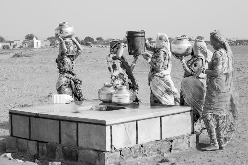 Women procuring water from a rejuvenated 'beri' (shallow drinking water well) in the bed of a rivulet in village Hema in Jaisalmer district, Rajasthan, rejuvenated by Chattar Singh Jam, the Water Wizard of Thar Desert
